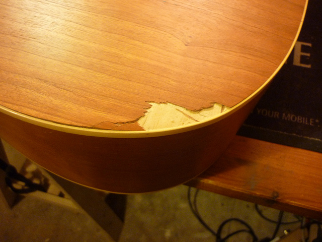 A Norman guitar trashed by the postie